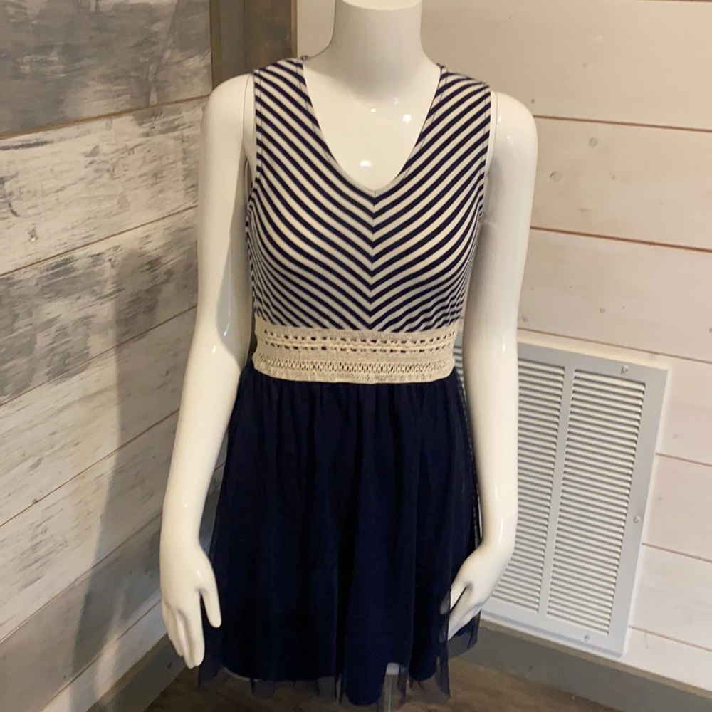 Comfy pull over dress with stripes on top and light tulle over bottom layer.